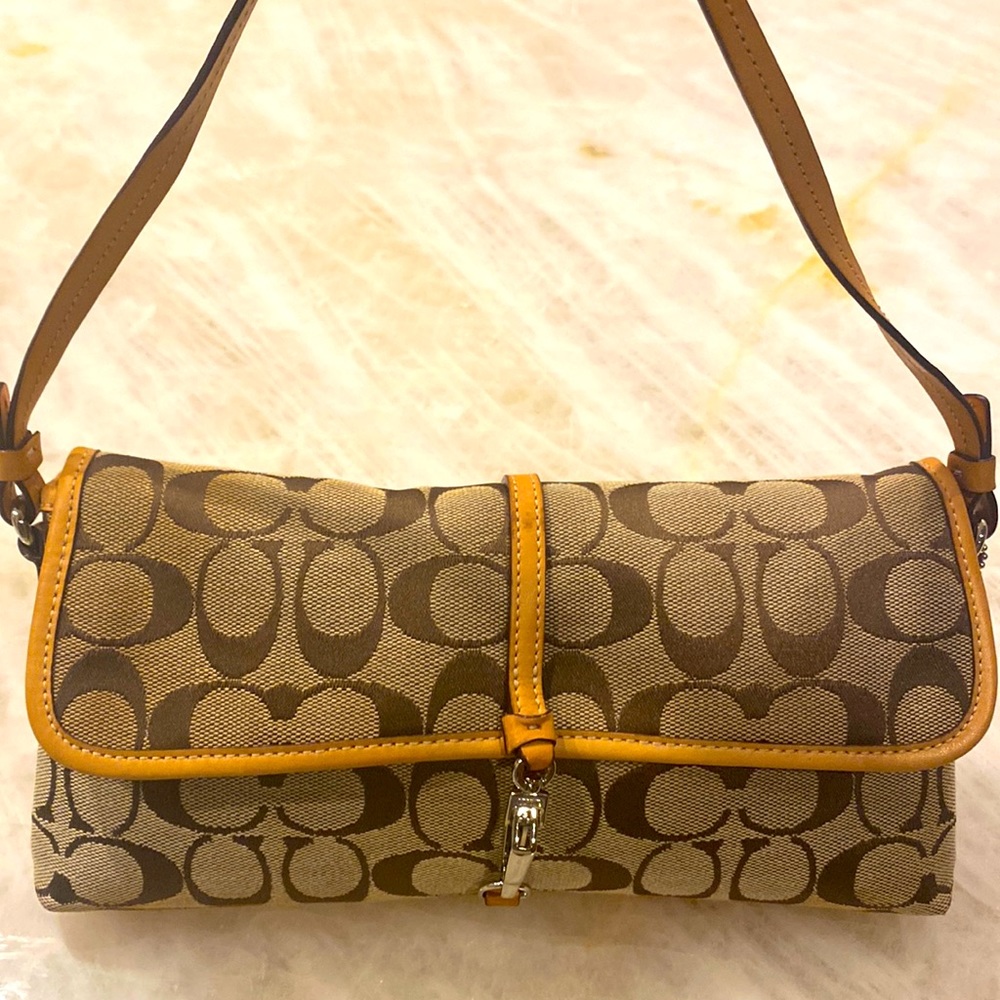 EUC Coach signature canvas tan small bag with leather details.